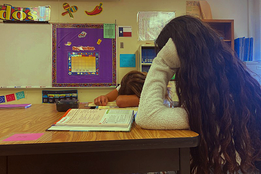 Juniors Valerie Mendez and Jordan Jones slump over their Spanish textbooks. (Photo illustration)