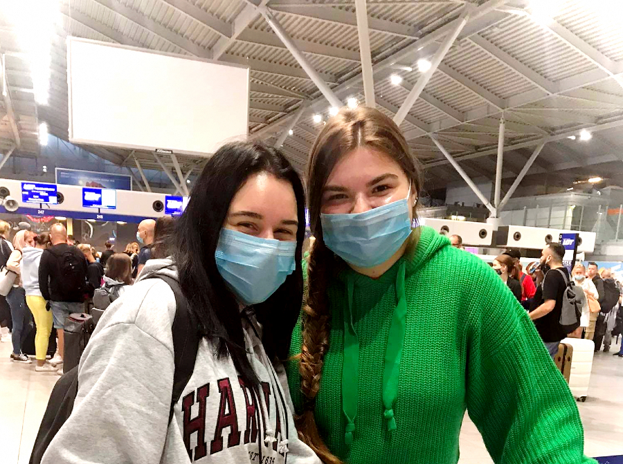 Best friends saying goodbye to each other at the airport.