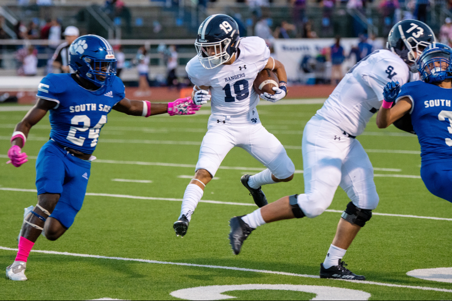 Working upfield, returner Brayden Bafidis goes skyward against South San on Oct. 15. Bafidis' special teams acumen has been integral to the Rangers' success this season.