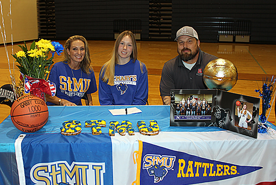 Gabby Elliott signs to play basketball at St. Mary's University. Elliott scored her 1,000th career point in this season's opener against Stevens.