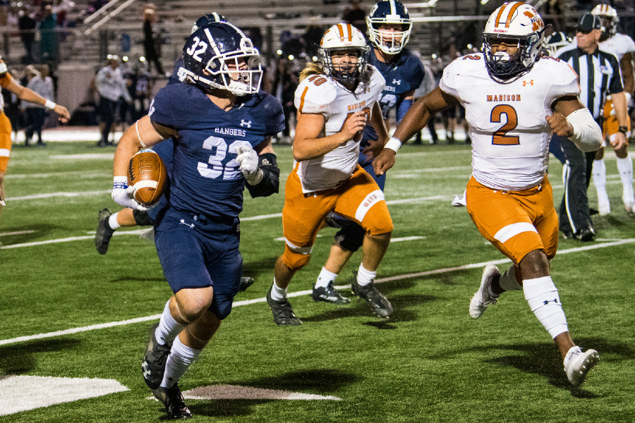 Travis McCracken runs for a first down against Madison in the Rangers' Bi-District playoff game. McCracken leads the team with 868 yards rushing and 12 touchdowns.