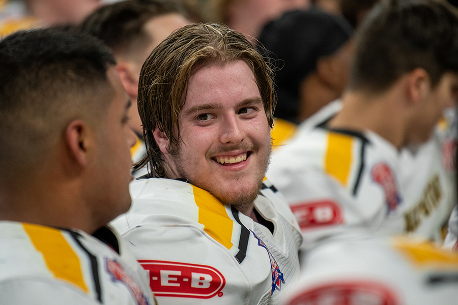 After Team Gold's win, offensive linemen Nick Freeman grins during the trophy ceremony. Freeman earned first team All-District 27-6A honors at left guard.