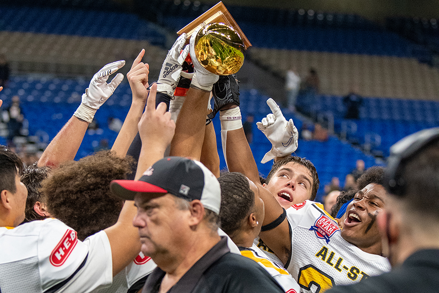 Dylan Domel and Malachi Lane bask in the glory of the San Antonio All-Star Game trophy. Team Gold won the game, 18-9.
