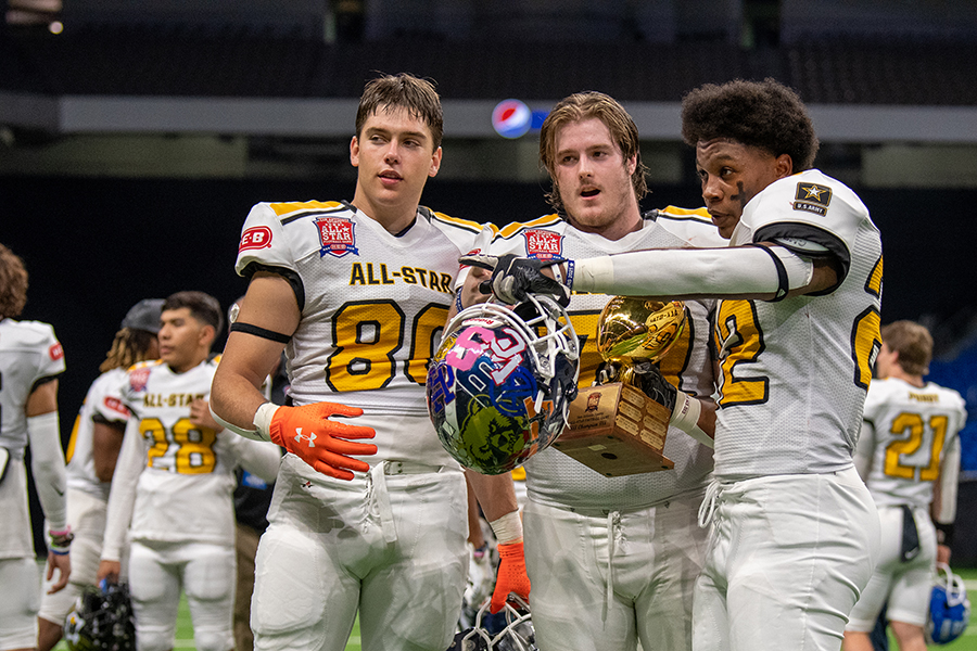 Dylan Domel, Nick Freeman and Malachi Lane pose with the San Antonio All-Star Game trophy after Team Gold's 18-9 win. All three players earned first team All-District honors after leading the Rangers to a 9-3 record.