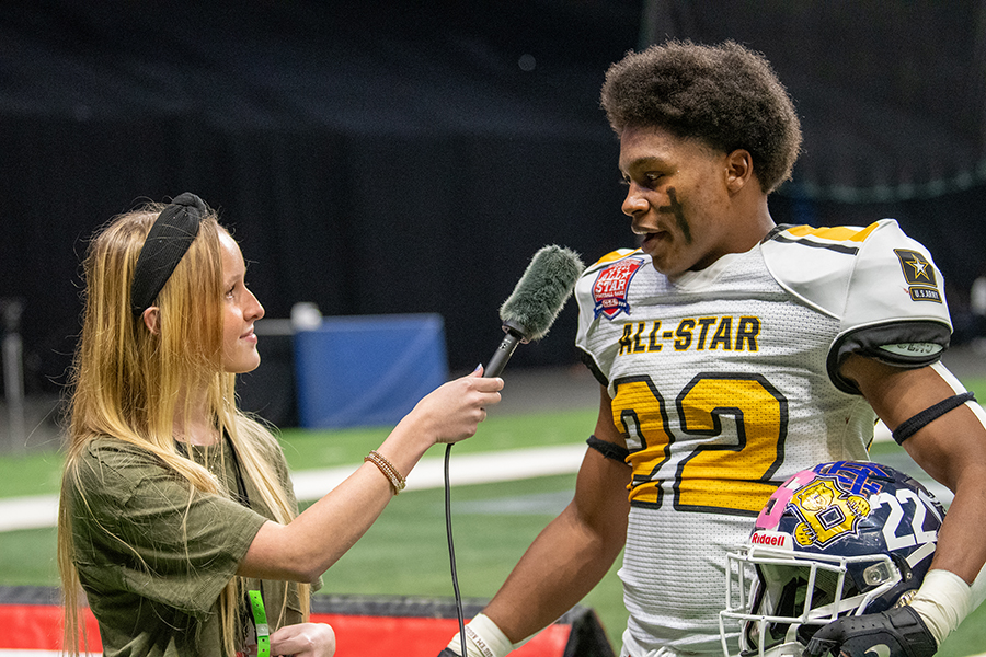 Staff writer Kaley Bonds interviews Malachi Lane after Team Gold's 18-9 victory. Lane earned District 27-6A MVP honors after racking up 92 tackles and 12 tackles for loss.