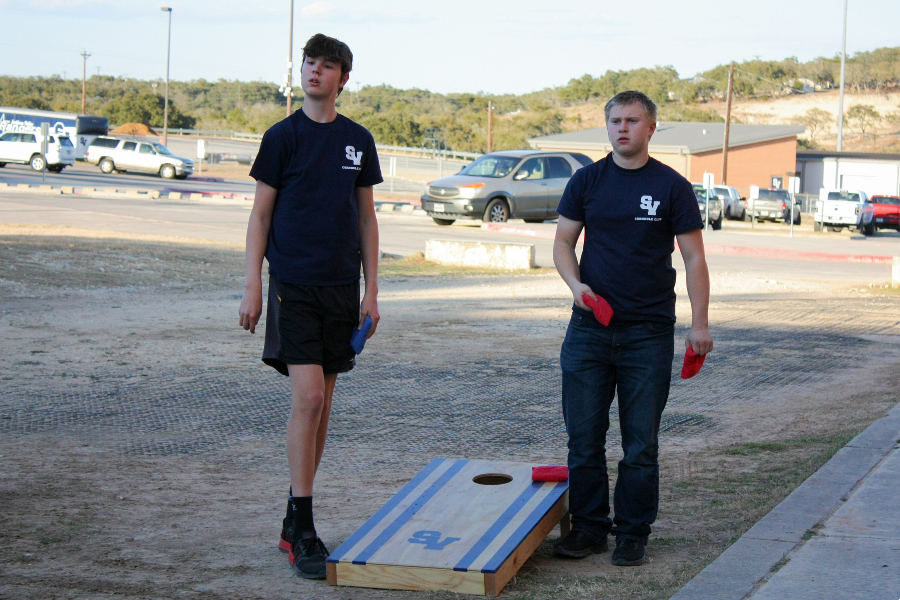 Sophmore Pierce Loveless waits for his opponent to throw his bean bag.