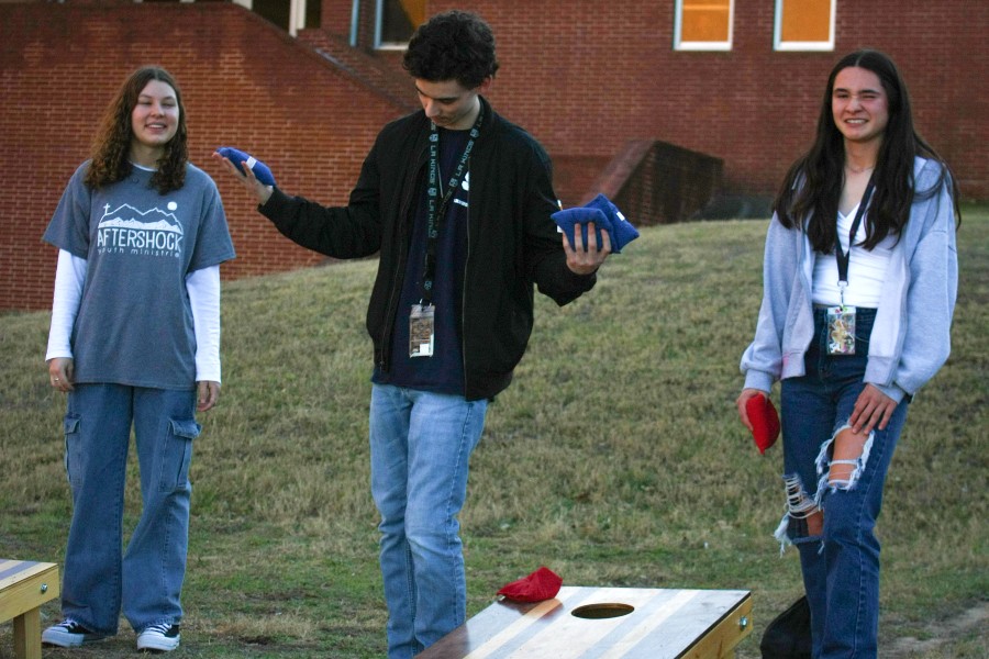 Club president Ryan Lapp celebrates his first cornhole of the day.