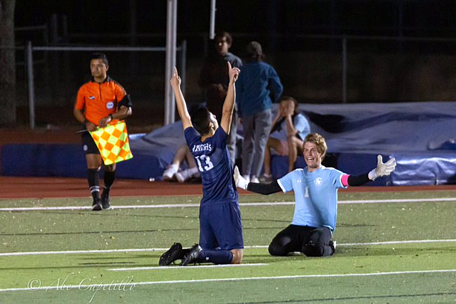 Matthew (Ice In His Veins) Capetillo celebrates with goalkeeper Cole Hansen after scoring the final penalty kick to seal the win against Westlake on March 29.