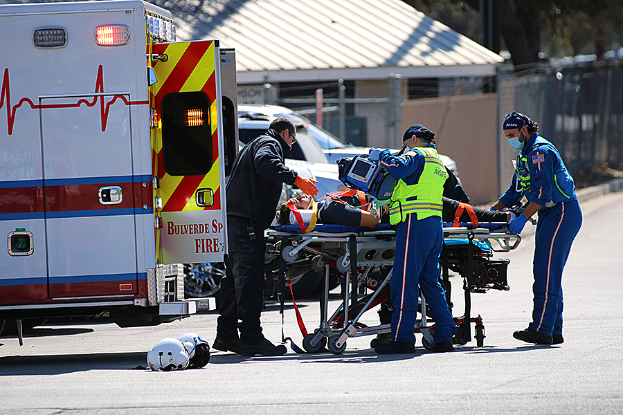 Tyler Stone is taken into an ambulance by EMTs.