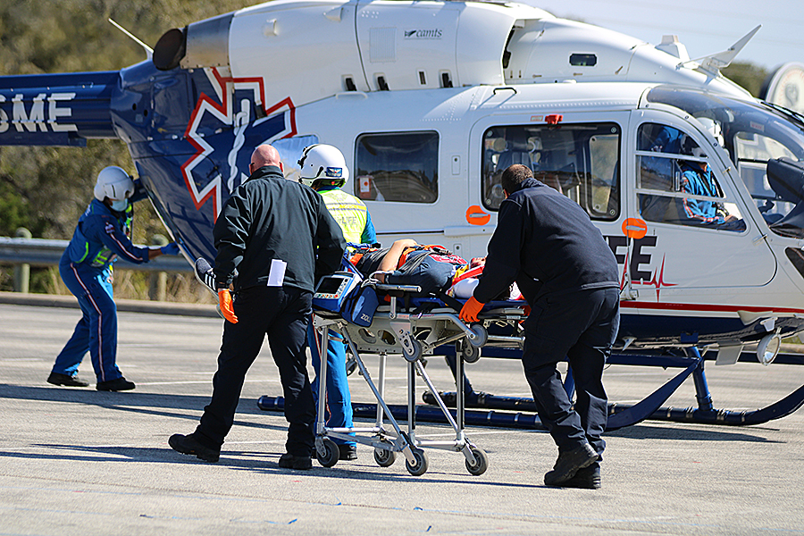 Junior Tyler Stone is taken to an AirLife helicopter after being "injured" in a car accident.