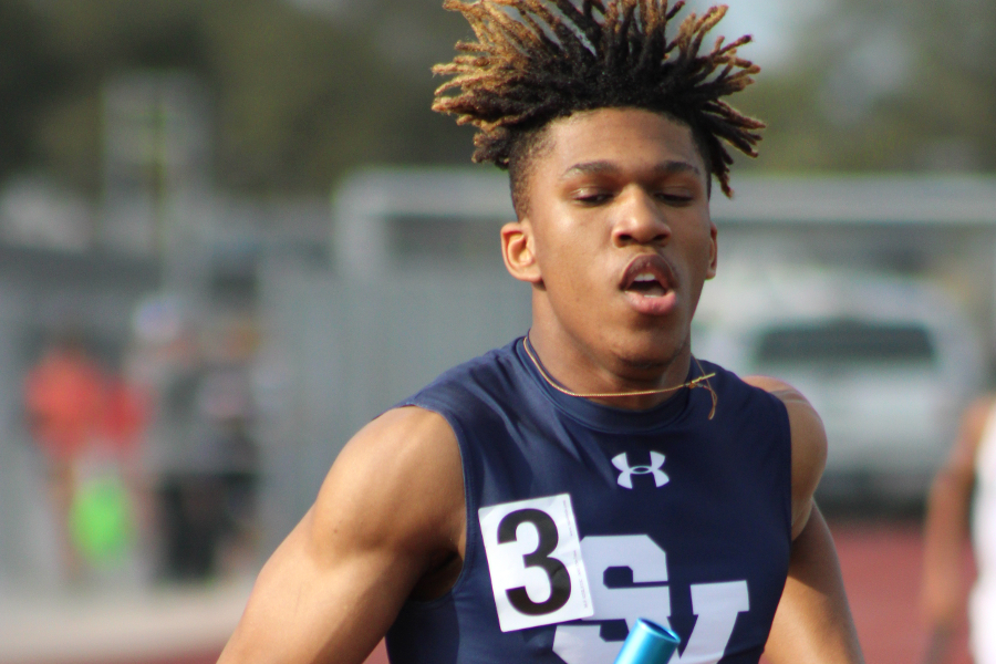 Tevijon Williams finishes the fourth leg of the 4x400 relay on March 5.