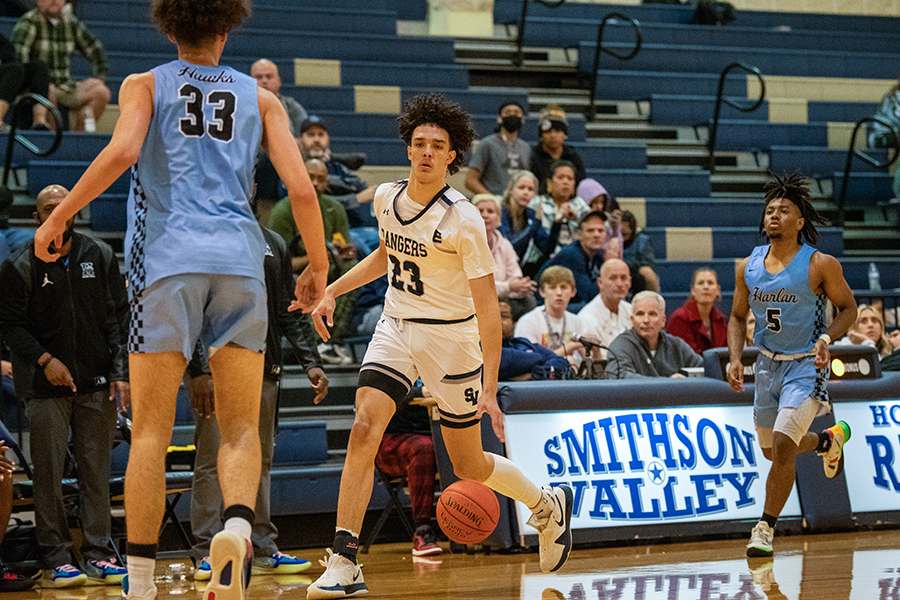 Junior Zayden High brings the ball down the court against Harlan in November. 