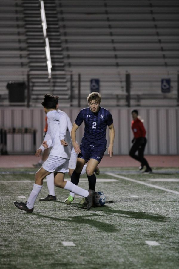 Dildy maneuvers around an opponent in a home game against Wagner. 