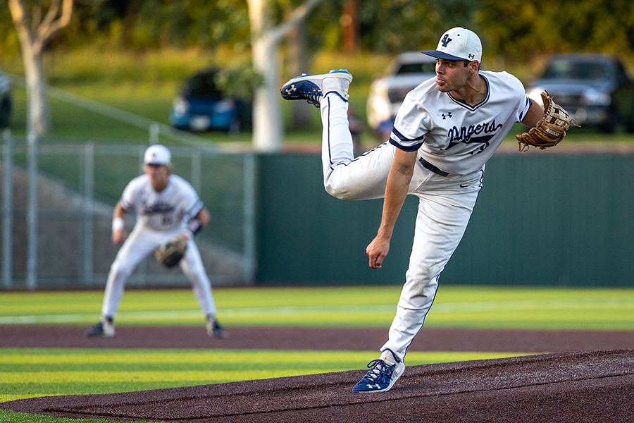Tim Arguello hurls a pitch in a playoff game against Austin Westlake. On Thursday, Arguello started the Rangers' Game 1 loss to Reagan, striking out four batters and allowed no earned runs.