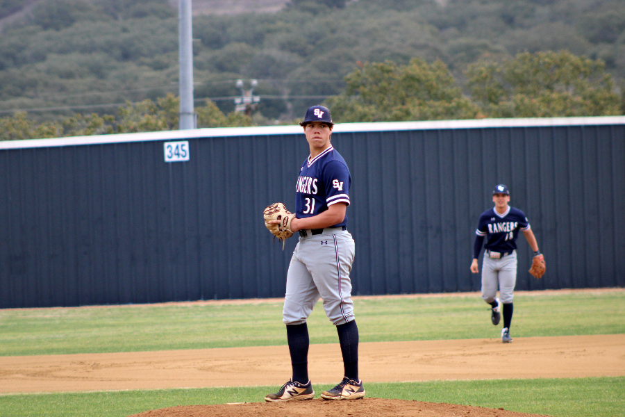 Sophomore pitcher MJ Espinoza winds up against Madison on March 4. Espinoza pitched 4.1 scoreless innings across two appearances against Churchill.