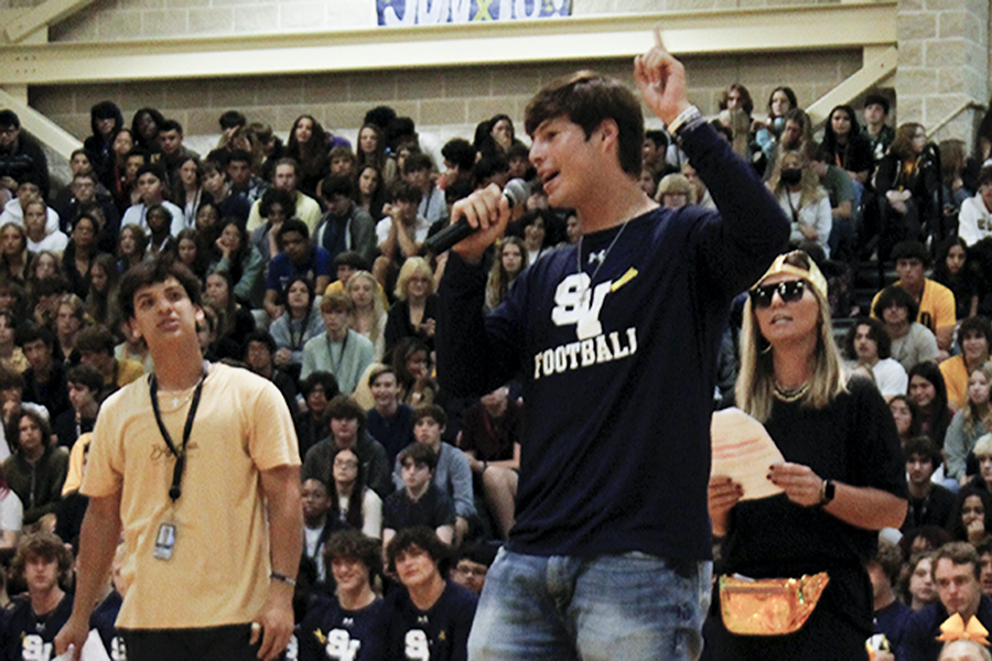 Senior Tyler Stone announces football's game against Canyon.