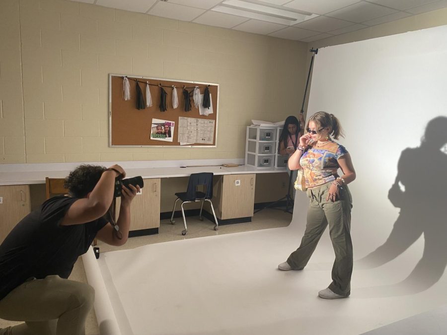 Freshman Olivia Kronowit poses for 'Haute' magazine at last weeks meeting.
