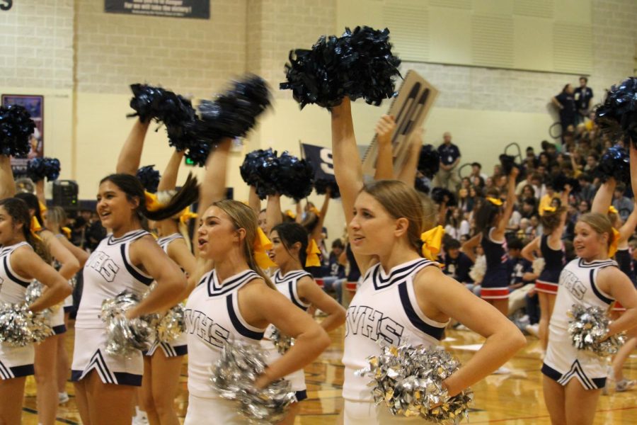 Varsity cheer performs its routine to kick off the pep rally.