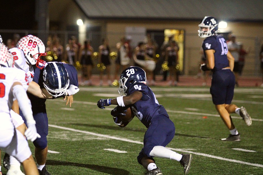 Senior Isaiah Vivians runs the ball downfield against Canyon.
