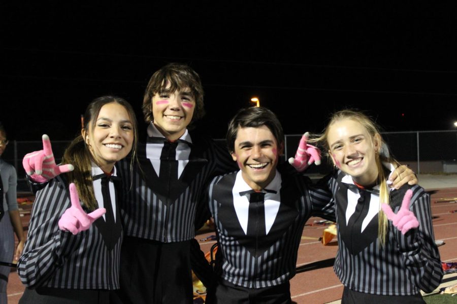 Band Students ready to perform for the Halftime show at the Varsity Football Pink Out game.