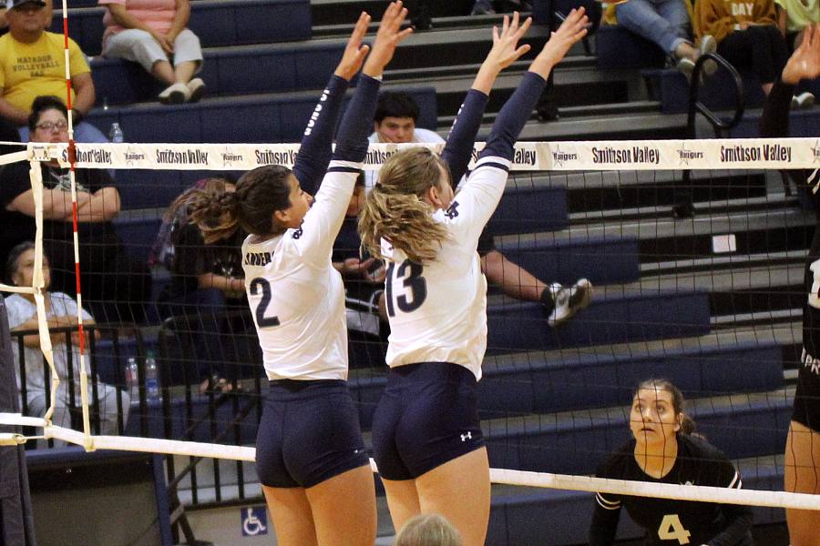 Volleyball ties for first in district. 