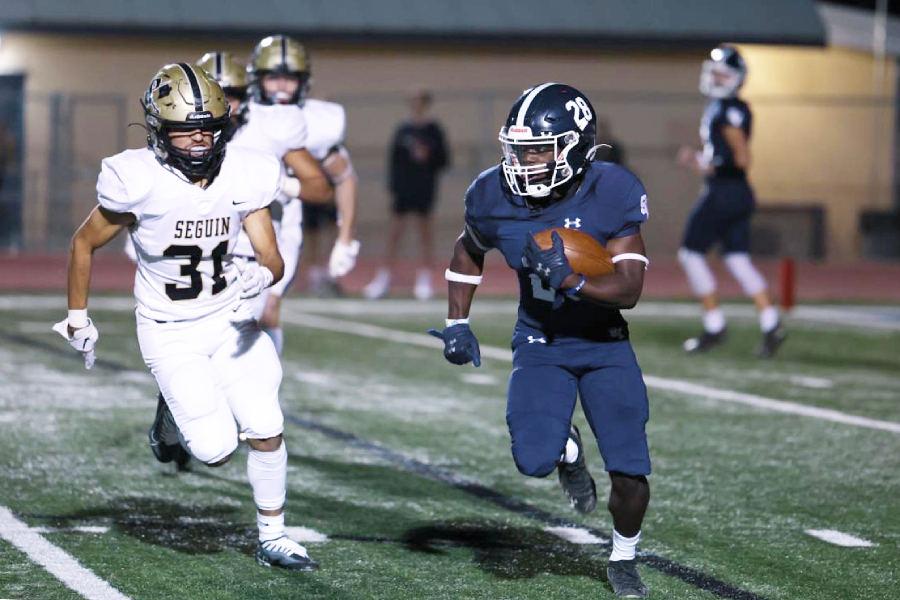 Senior Isaiah Vivians makes his way down the field in the team’s 56-17 rout over Seguin Nov. 4. The win sealed a perfect district season.
