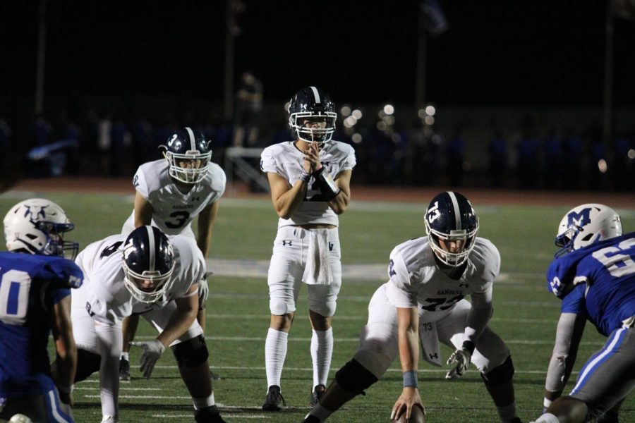 Chase Senelick prepares to catch a snap against MacArthur.