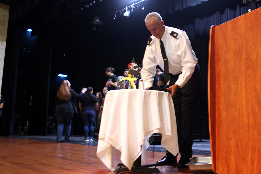 Chief Daniel Hansen sets the table for the tribute to American prisoners of war and those missing in action.