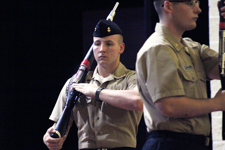 A member of the armed drill team, Donovan Hays performs in the auditorium for the Veterans Day ceremony.
