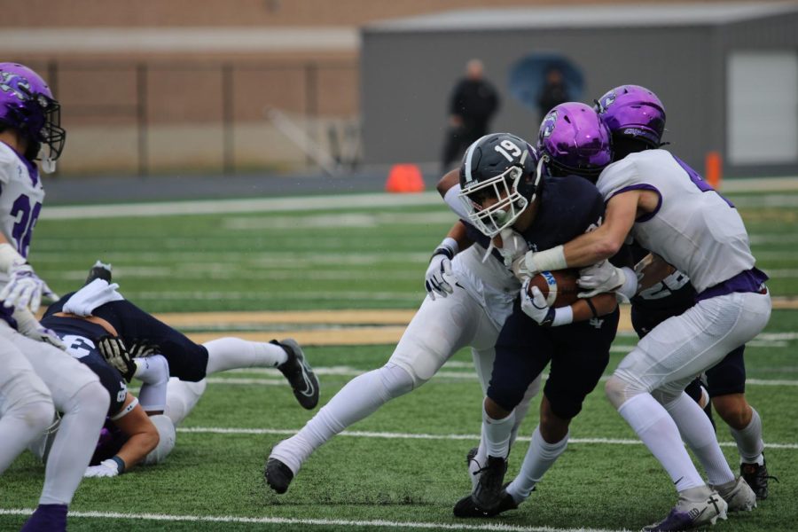 Senior Brayden Bafidis maneuvers through Fulshear opponents at the Rangers' regional game.