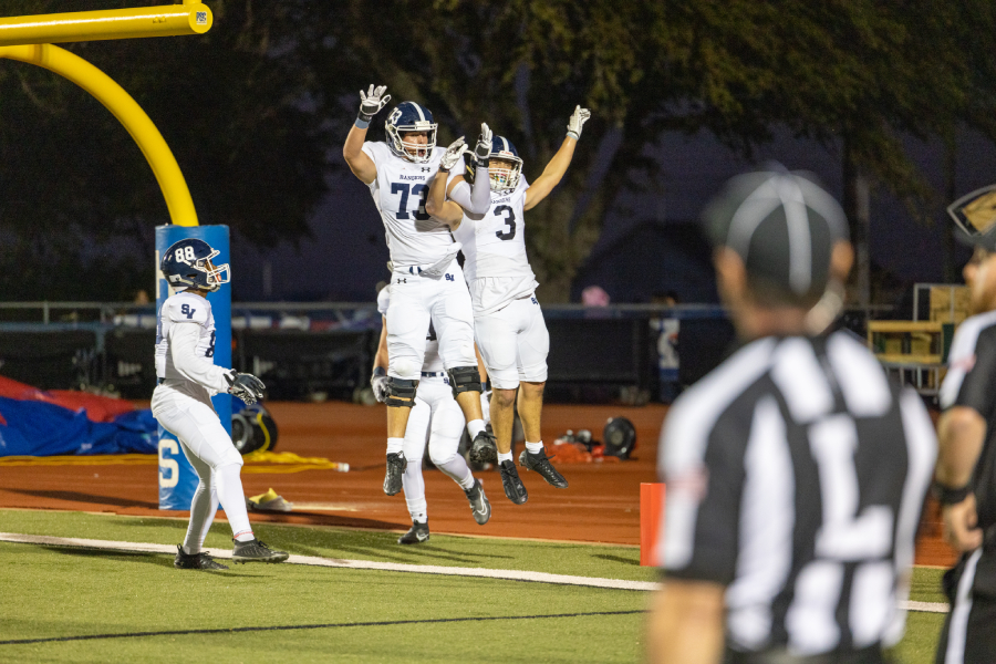 During the Buda Hays game Oct. 28 on the road, senior Corry Coleman senior Ty Stone and junior Doug Lantz celebrate after Lantz's touchdown in the 42-13 rout.
