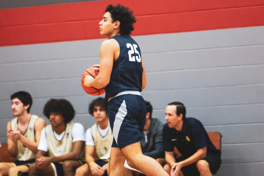 DJ Onezine looks for a pass on the court during a scrimmage at Judson