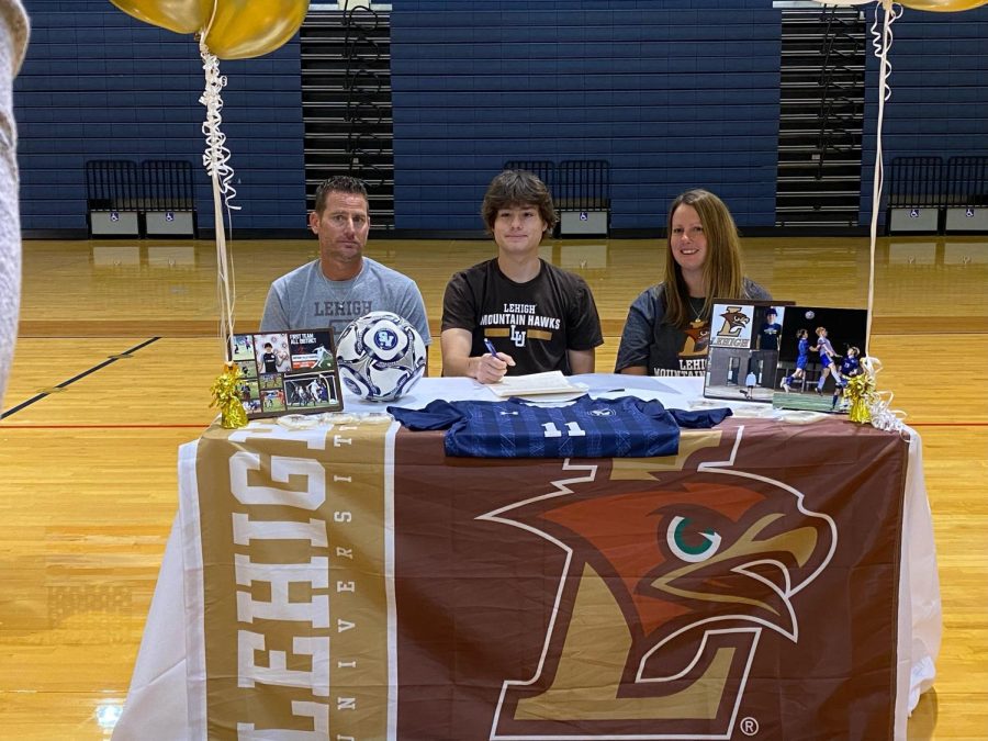 Jax Adkins signs to play soccer at Lehigh University.