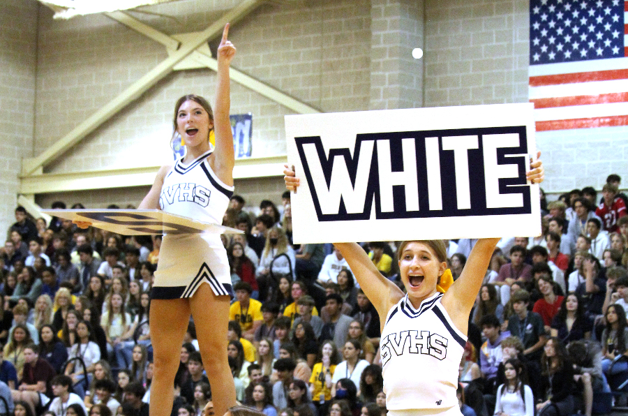 Varsity cheerleaders lead students in cheers at the gold out pep rally on Sept. 22.