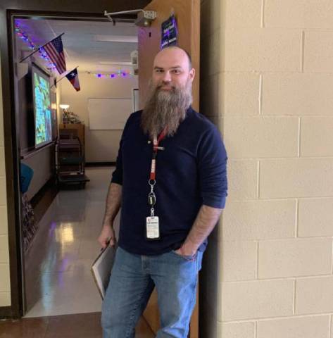 Klaus Weinelt outside his Social Studies Classroom