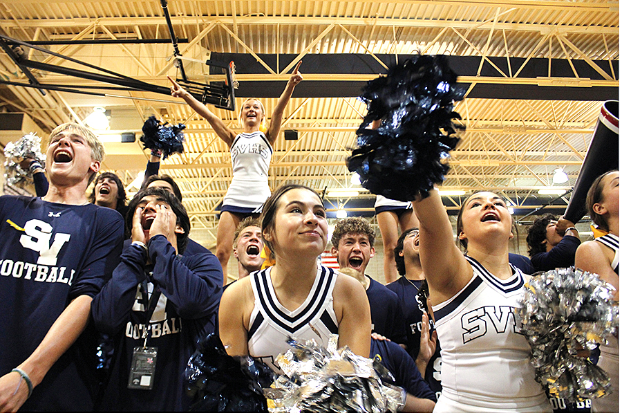 Senior cheerleader Tatum  Esp, is joined by seniors on the football team to hype up the seniors in the stands for the yell-off.