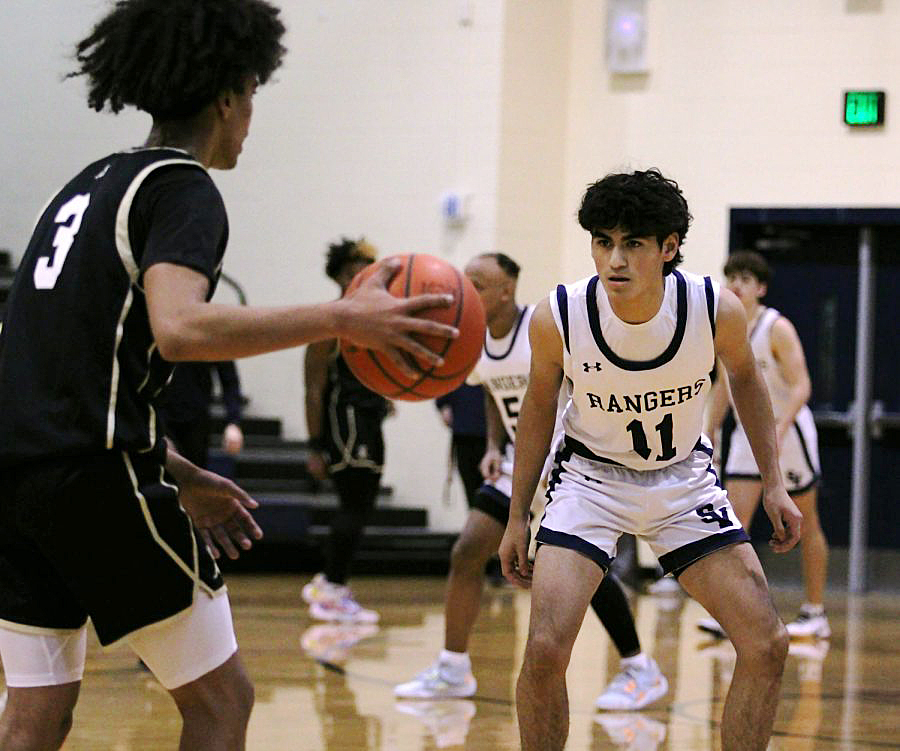 Junior Jason Cruz watches the ball closely as Seguin looks for an open pass.