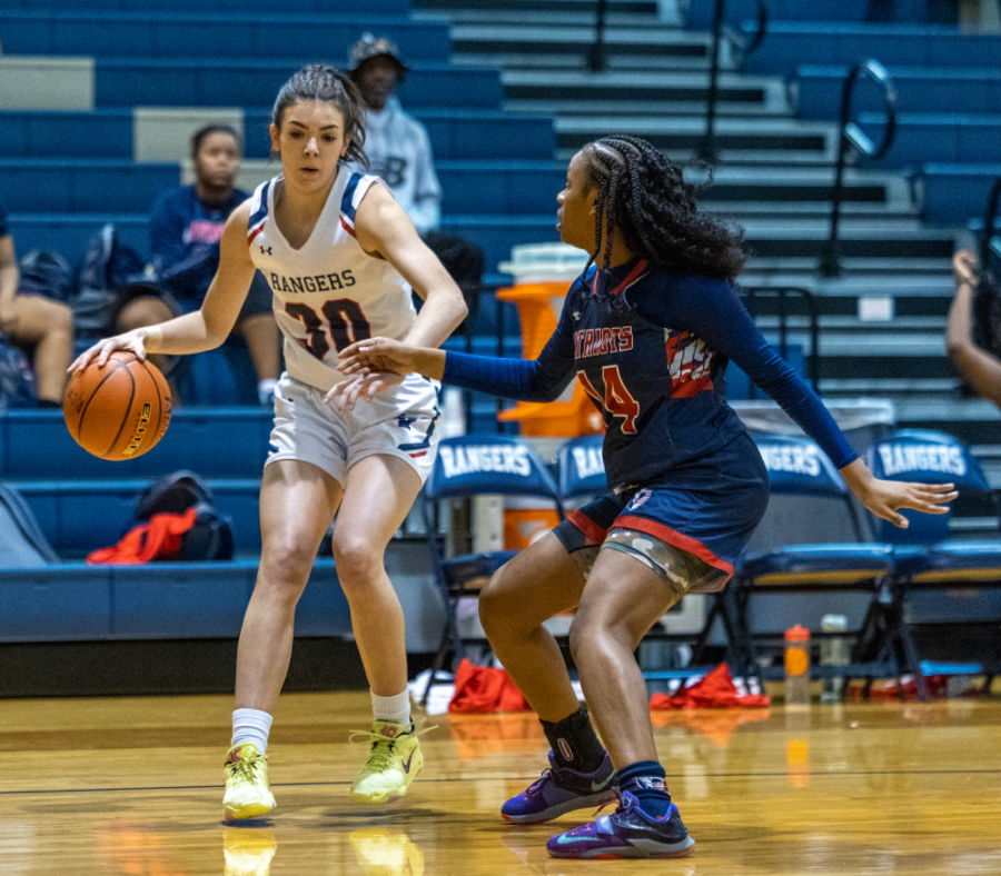 Senior captain Caroline Dyess makes a move on a Veterans Memorial player.