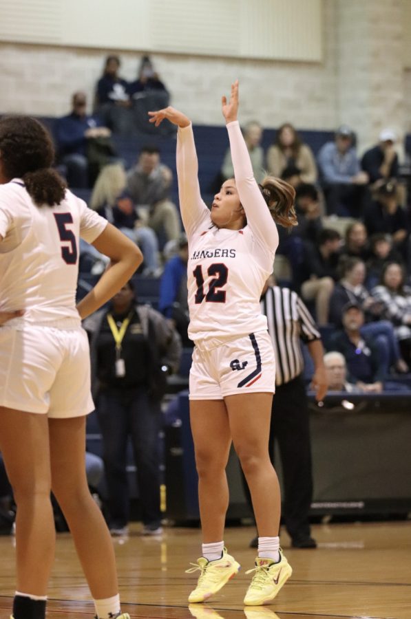 Junior Bella Reyes shoots free throws after getting fouled on a layup.