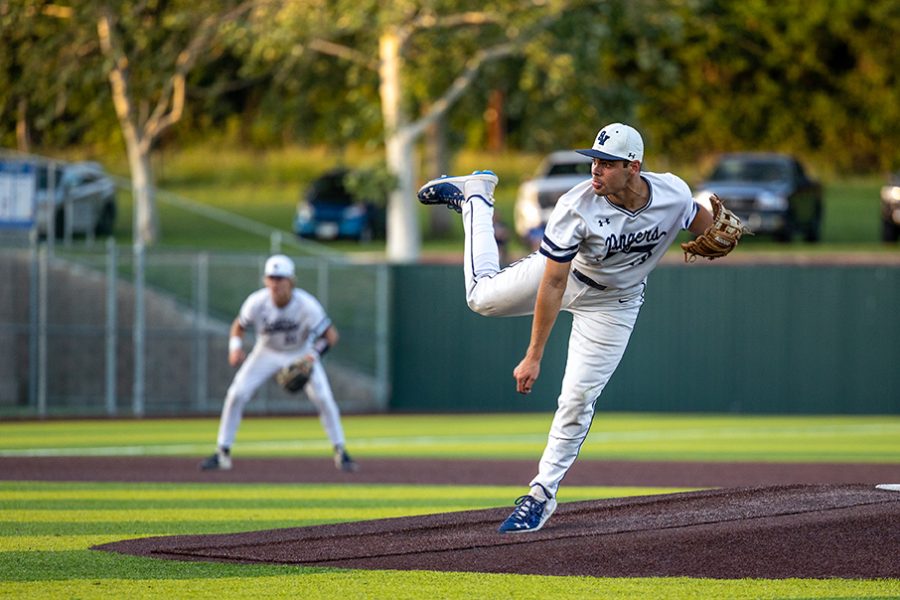 Tim Arguello hurls a pitch in a playoff game against Austin Westlake. On Thursday, Arguello started the Rangers' Game 1 loss to Reagan, striking out four batters and allowed no earned runs.