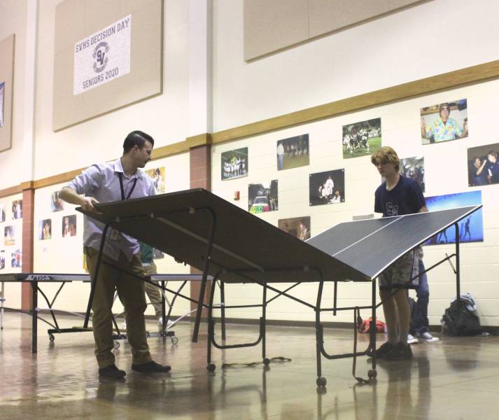 Ping Pong club gets ready for weekly meeting inside the rotanda 