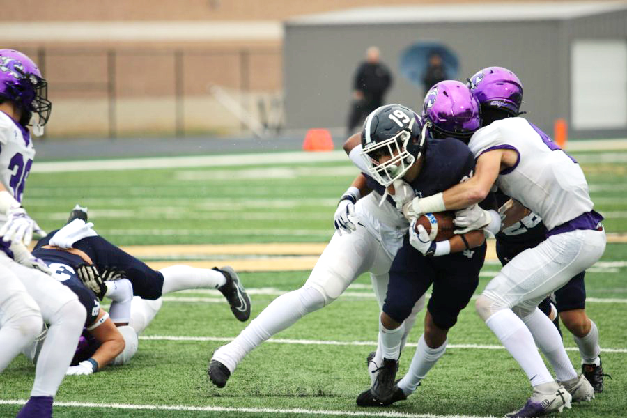 Senior Brayden Bafidis maneuvers through Fulshear opponents at the Rangers' regional game.