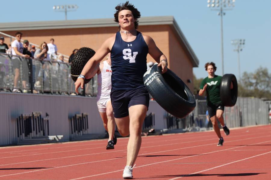 Junior Jaxon Maynard runs in the tire race at Ranger Relays. 