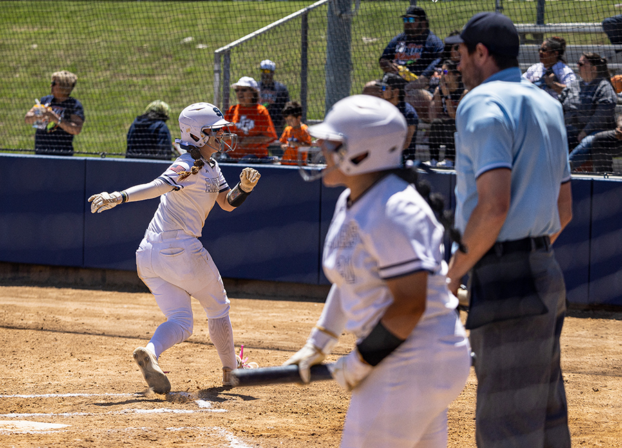 Senior Abby Brand crosses the plate during Saturday's second game at home. After taking a loss on Friday, the girls won the best-of-three series with a 6-3 win (on a grand slam homerun) in Game 2 and a 4-2 victory in Game 3.