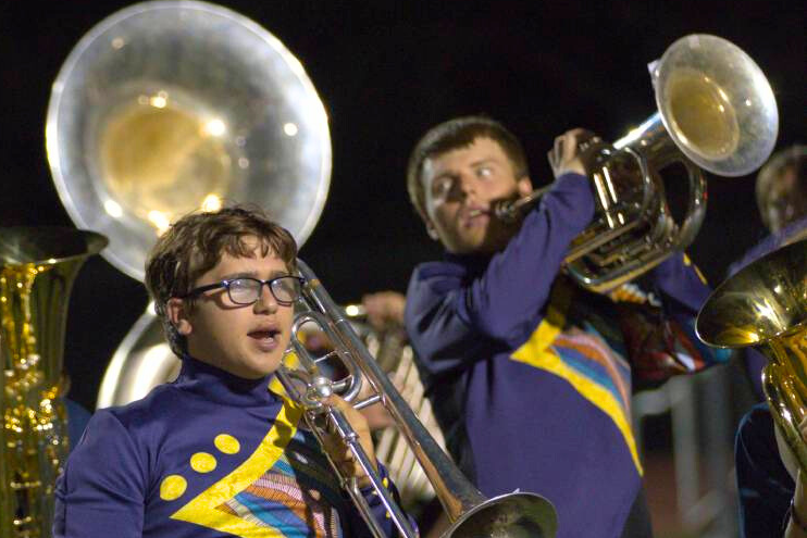 Sophomore Nolan Wilson adds his voice to the performance of The Voices Within during a halftime performance on Sept. 15 at Ranger Stadium.