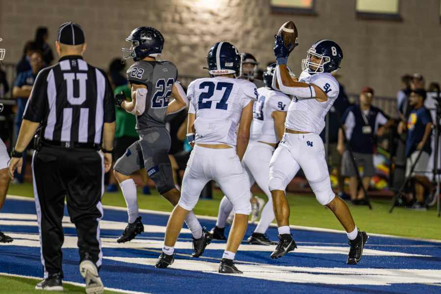 Nicholas Dudzikowski and Zack Gingrich celebrate a defensive touchdown against Boerne Champion Oct. 20.