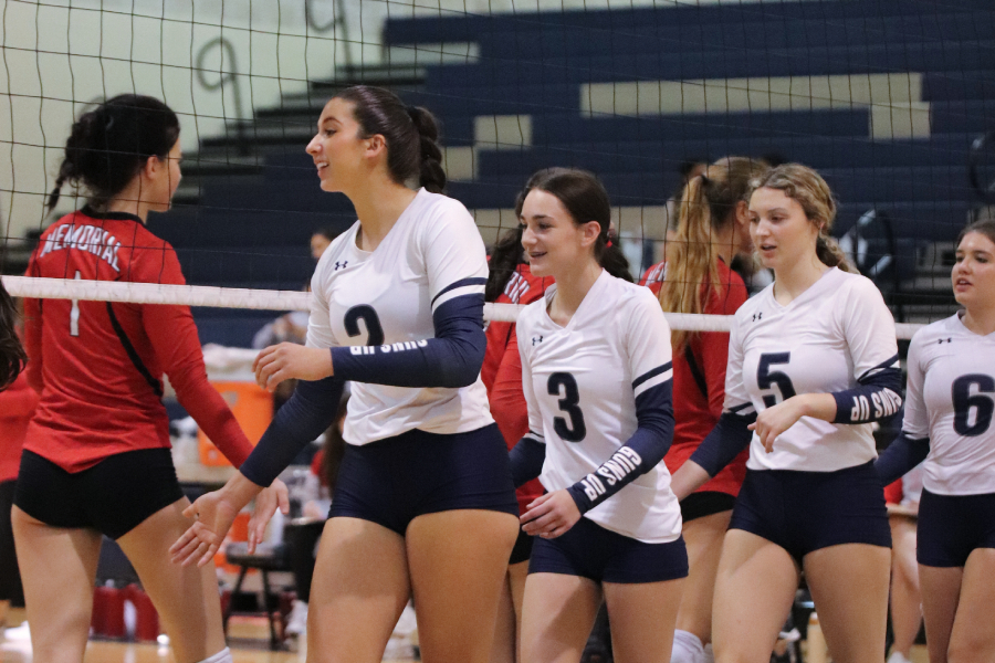Varsity shaking hands with Veterans Memorial after a win. Shown in the photo starting from the left is senior Olivia Fuentes, junior Braelyn Byno, junior Amanda Teran, and junior Marlowe Berry.