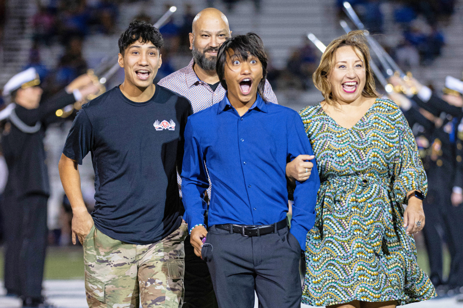 Sophomore Milo Corona gets announced as a member of homecoming court at the homecoming football game on Friday.