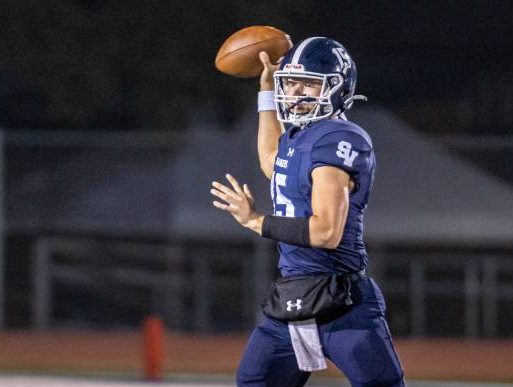 Senior quarter back Ryland Walker looks to throw a pass in the first round playoff game against Georgetown.