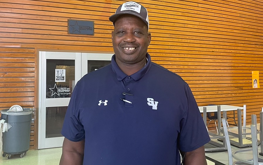 After cleaning senior dining during fifth period Willie Grubb poses for a picture. 